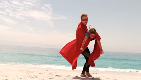 father and son dressed as superman