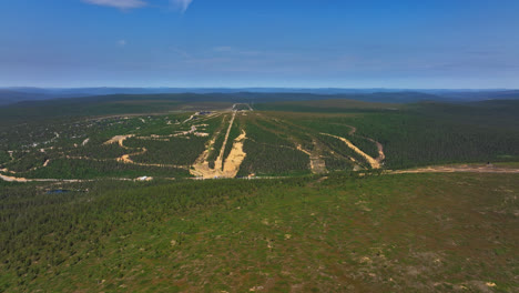 Slopes-of-the-Saariselka-ski-center,-sunny,-summer-day-in-Finland---Aerial-view