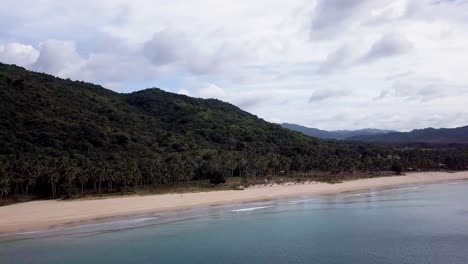 Vista-Aérea-De-4k-Con-Drones-Del-Largo-Tramo-De-La-Playa-De-Nacpan-En-El-Nido,-Palawan,-Filipinas,-Interminable-Playa-Tropical