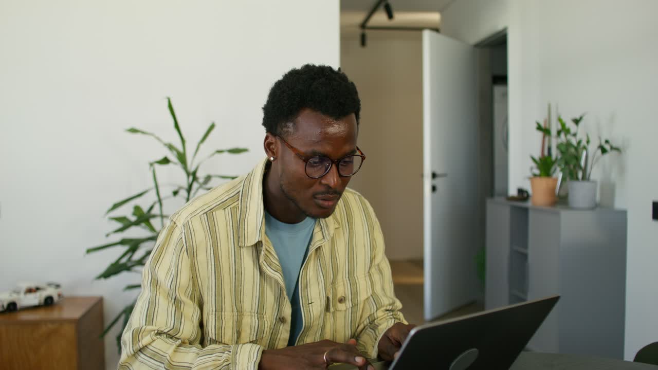 Man working on a laptop at home