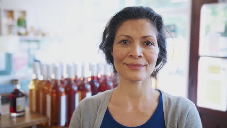 Portrait-Of-Mature-Woman-Running-Organic-Farm-Shop