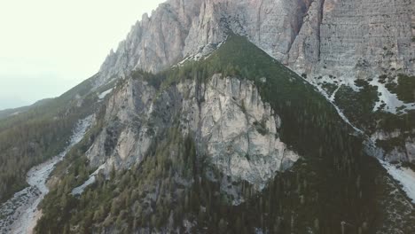 crane up drone shot in the alps of mountains and rocky cliffs
