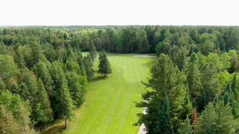 Aerial-shot-of-a-sunny-golf-course-fairway