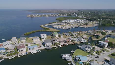 4K-Drone-Video-of-Beach-Park,-Marina,-and-Waterfront-Homes-in-Hudson-Beach-on-the-Gulf-of-Mexico-in-Florida