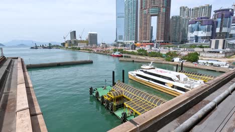 view of harbor with boats and tall buildings