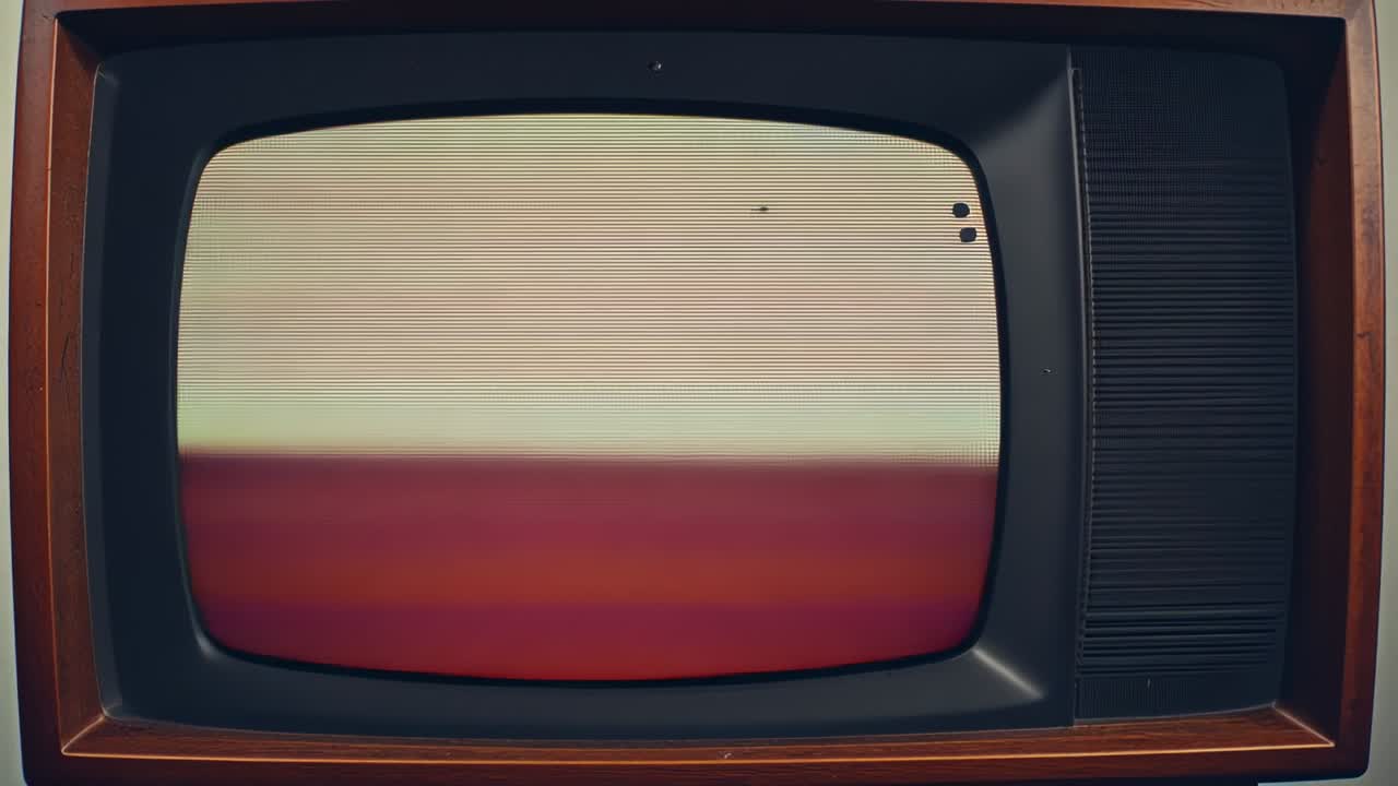 Powering vintage wooden CRT TV displaying pulsing static bands against pale wall, speaker grille