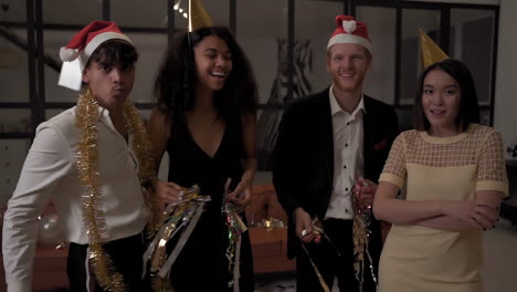 Female-And-Male-Happy-Friends-Dancing-With-Confetti-And-Celebrating-A-Party-At-Home