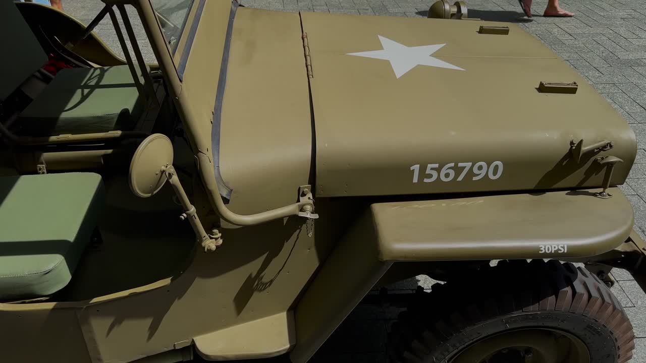 US Army jeep vintage military vehicle on display closeup of hood - khaki