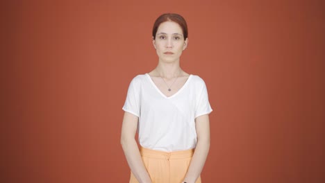 woman looking at camera with dull expression.