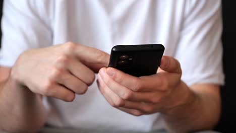 man-scrolling-his-smartphone