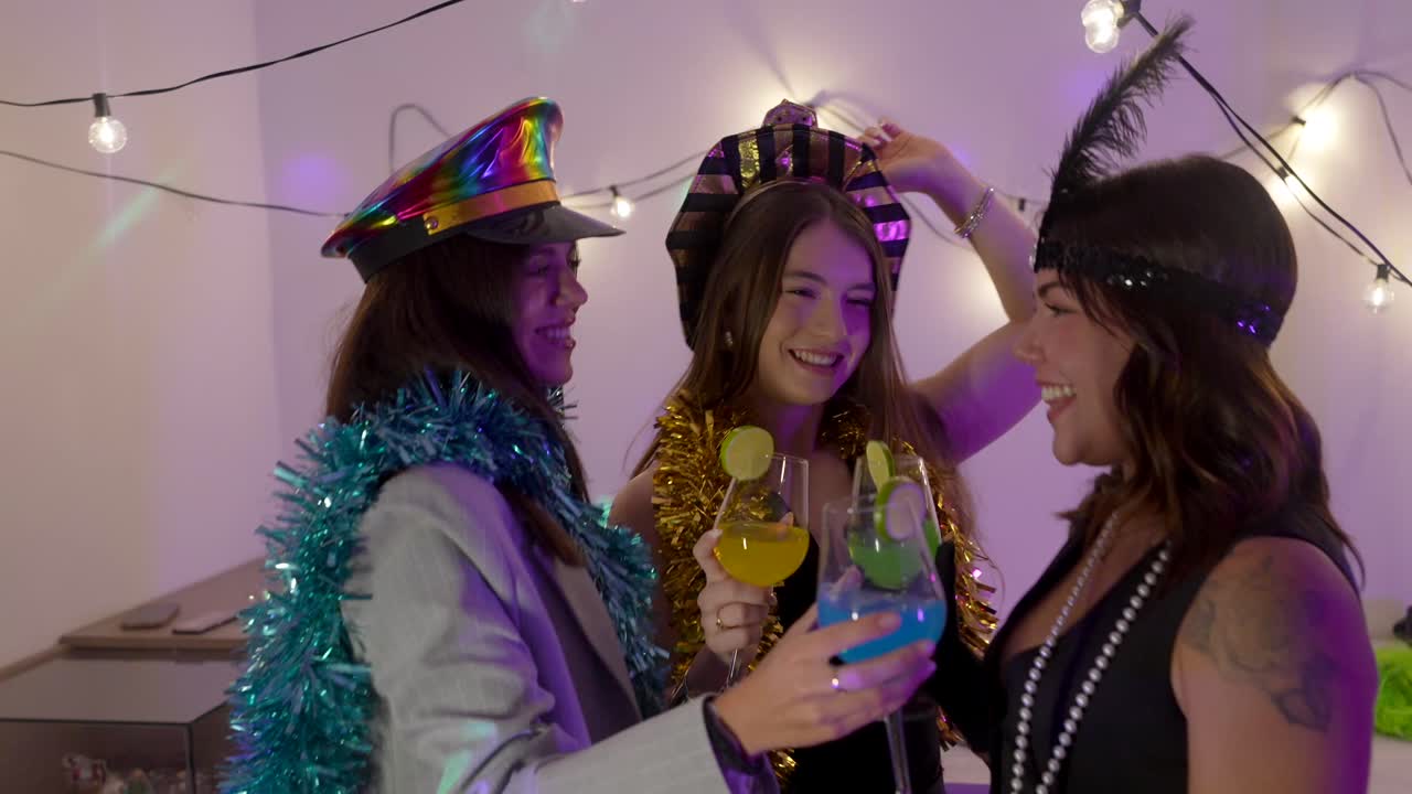Women celebrating with costumes and cocktails