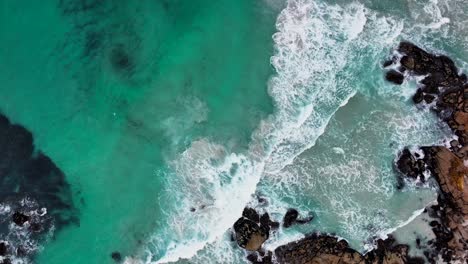 South-Africa-aerial-cinematic-drone-whirlpool-waves-crashing-coastline-Chapman-Peak-Noordhoek-Cape-Town-Hout-Bay-Fish-Hoek-Good-Hope-Simon's-Town-stunning-aqua-deep-blue-water-rugged-rocks-up-motion