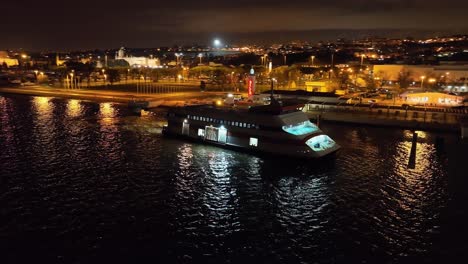 ferry boat crossing river at night