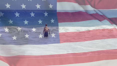 Animación-De-La-Bandera-De-Estados-Unidos-Sobre-Un-Hombre-Caucásico-En-El-Mar-En-Verano.