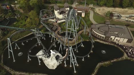 a high-speed rollercoaster in an amusement park in poland during the summer