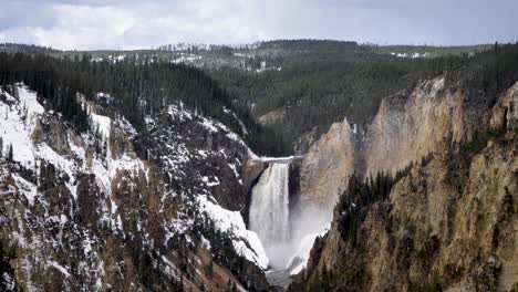 majestic waterfall in yellowstone national park during winter