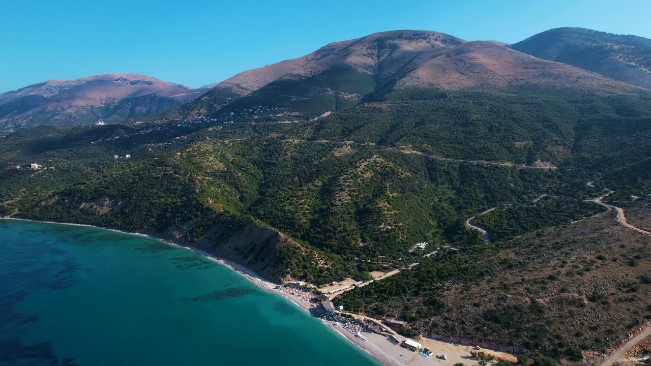 Scenic Albanian Riviera in Lukova: Olive Tree-Covered Hills, Majestic Mountains, Sun-Kissed Beaches, and the Azure Beauty of the Ionian Sea