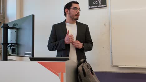 young man giving presentation at lectern