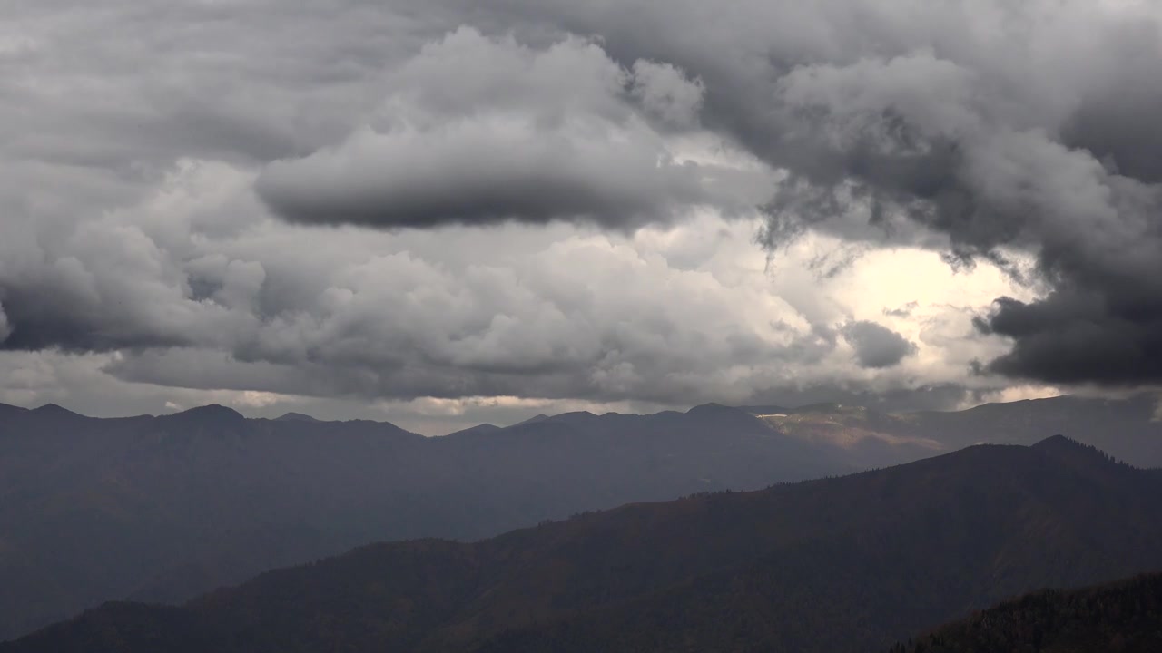Dark Stormy Clouds Moving Over Mountain Range