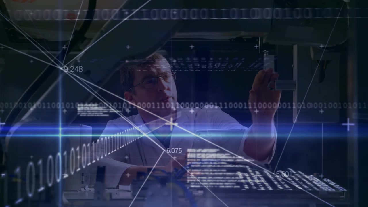 Animation of data processing over caucasian man using tablet in workshop