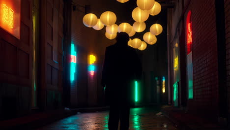person walks through a neon-lit alley under glowing lanterns at night