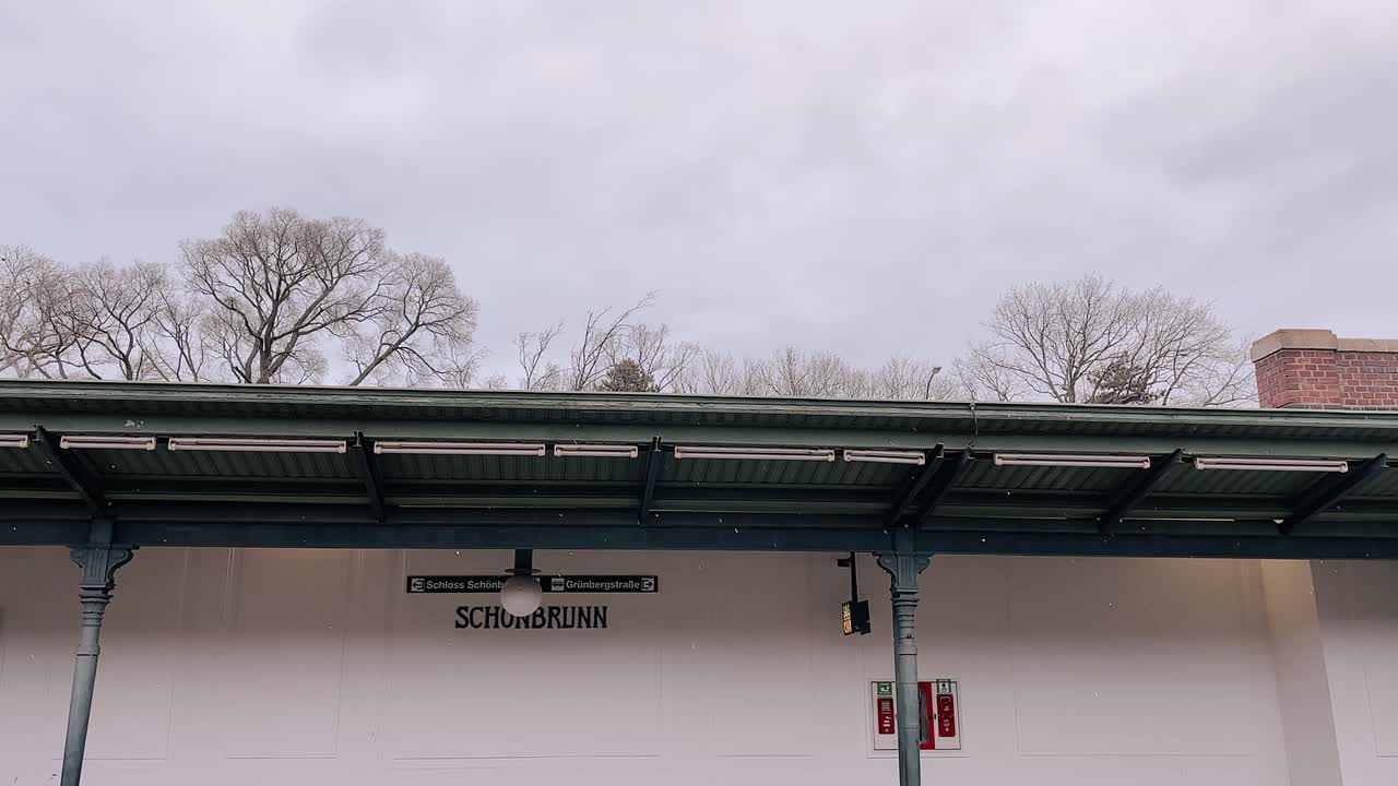 Schönbrunn metro station in Vienna with classic architecture and winter trees