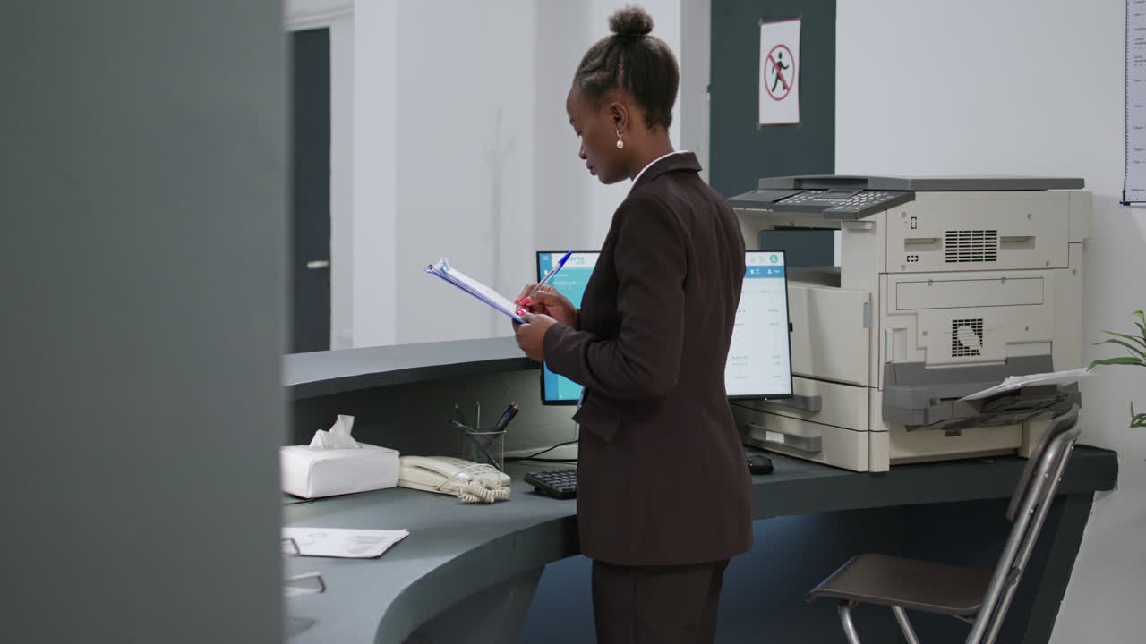 Receptionist in a hospital lobby