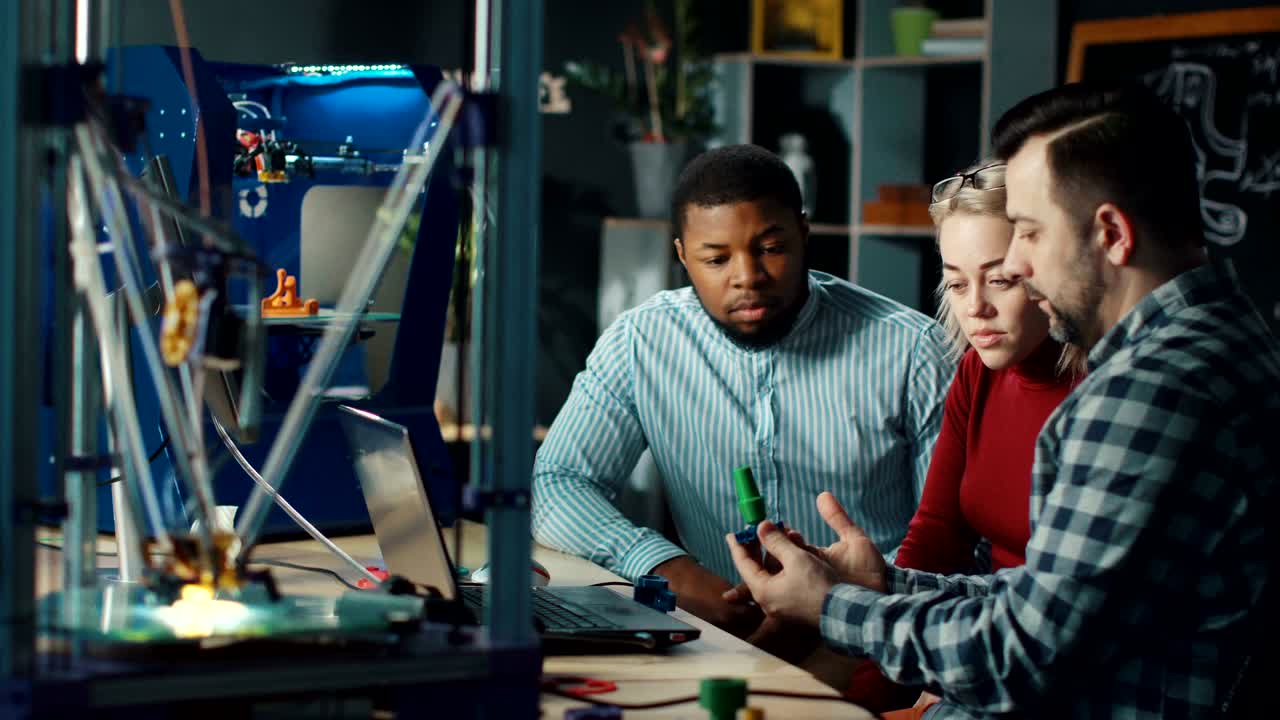 Designers having discussion in engineering lab
