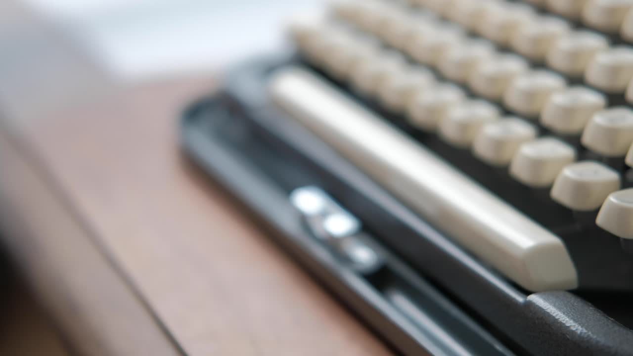 Close up caucasian woman hands opening portable typewriter
