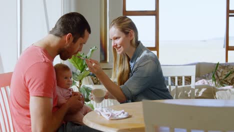 Parents-feeding-their-baby-boy-4k