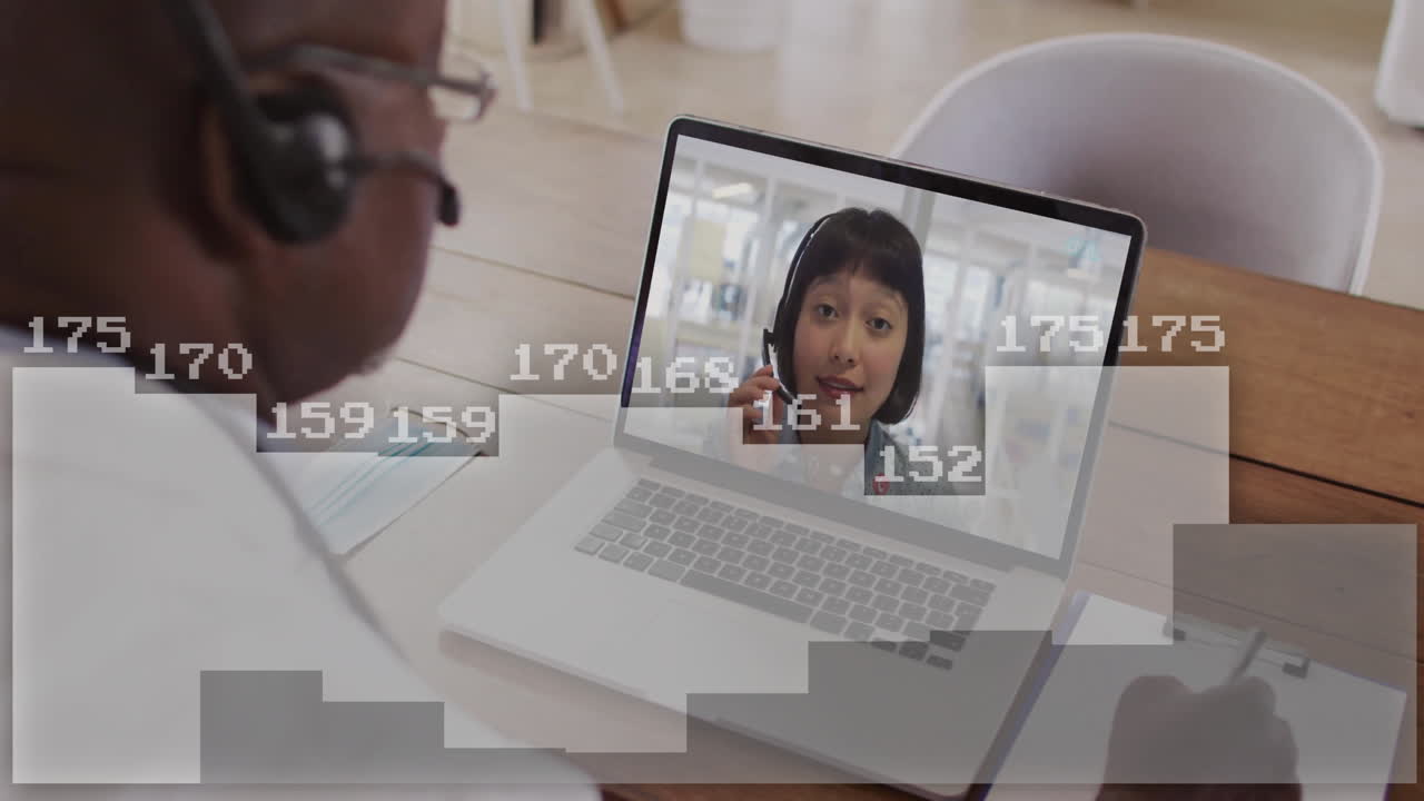 Animation of digital data processing over african american businessman on laptop video call