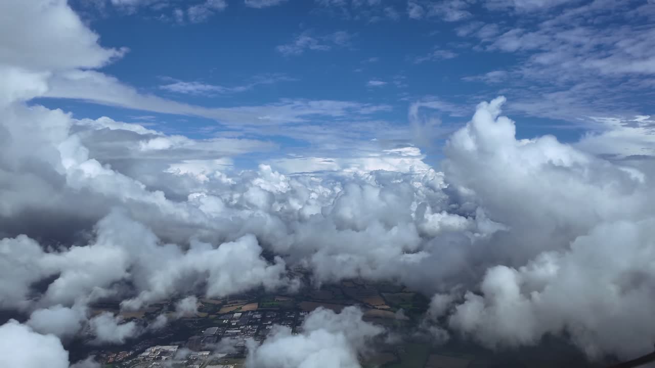 An immersive view of a Hypersonic speed flight through white cottony clouds under a blue sky