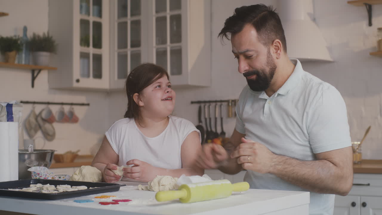 a Father Watches his Daughter Doing a Cartwheel in an Airport Terminal Preparing for a Flight a Father and Daughter Share a Playful Moment at an Airport with the Little Girl Doing a Cartwheel as they Wait for their Flight