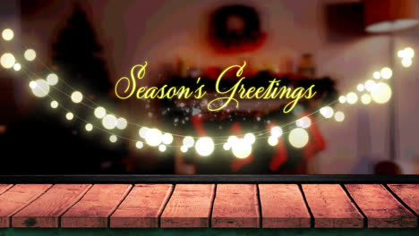 Animation-of-fairy-lights-and-seasons-greetings-text-over-wooden-boards