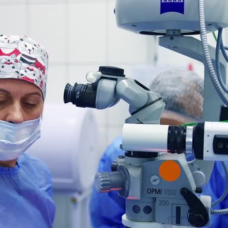 doctor using microscope for work