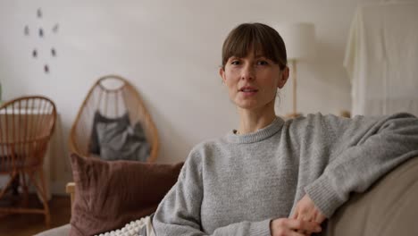 woman sitting on a sofa in a living room