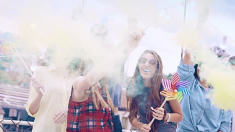 friends celebrate with colorful smoke