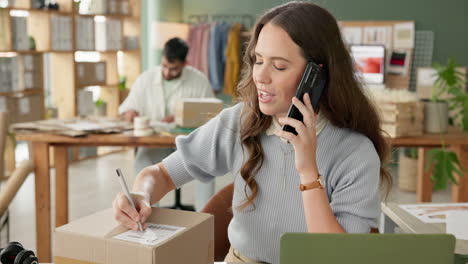 woman on a phone call in her small business office