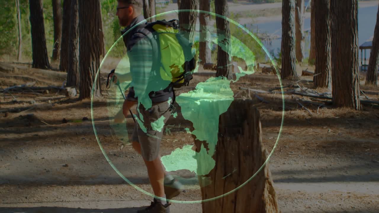 Globe overlay fading around stump rotating map while hiker walking forest trail for technology demo