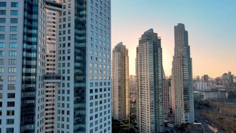 4K-Aerial-Drone-Footage-of-Puerto-Madero-Close-Up-of-Skyscrapers-During-Beautiful-Sunset