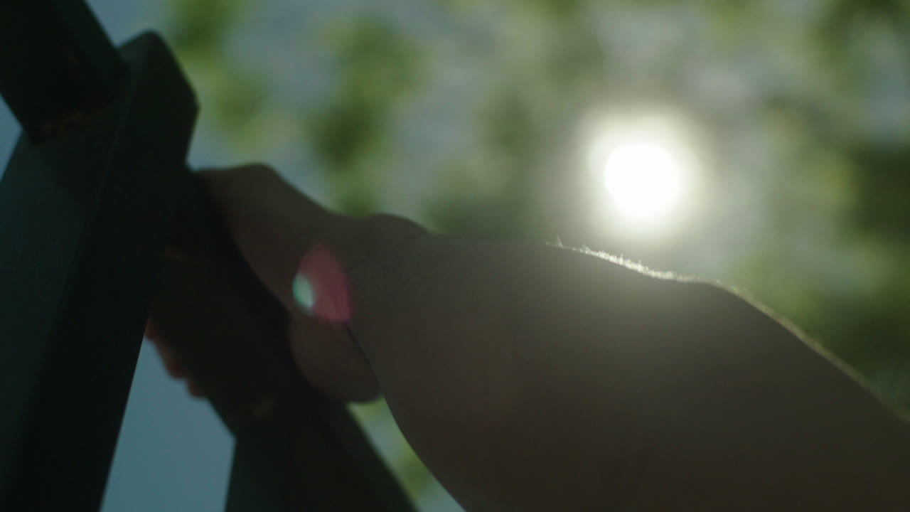 Person Doing Pull-ups Outdoors