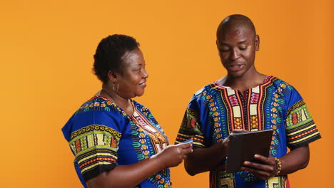 smiling man purchasing clothes on internet with credit card