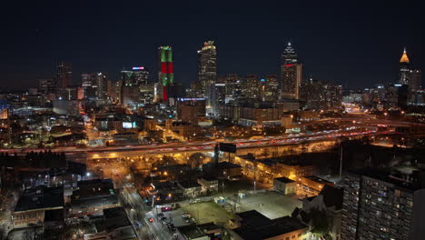 atlanta aerial v805 hyperlapse drone flyover across neighborhoods along edgewood avenue capturing traffic trails and illuminated downtown cityscape at night - shot with mavic 3 cine - december 2021