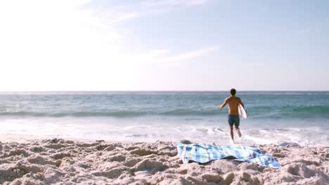 surfer running to go in the water