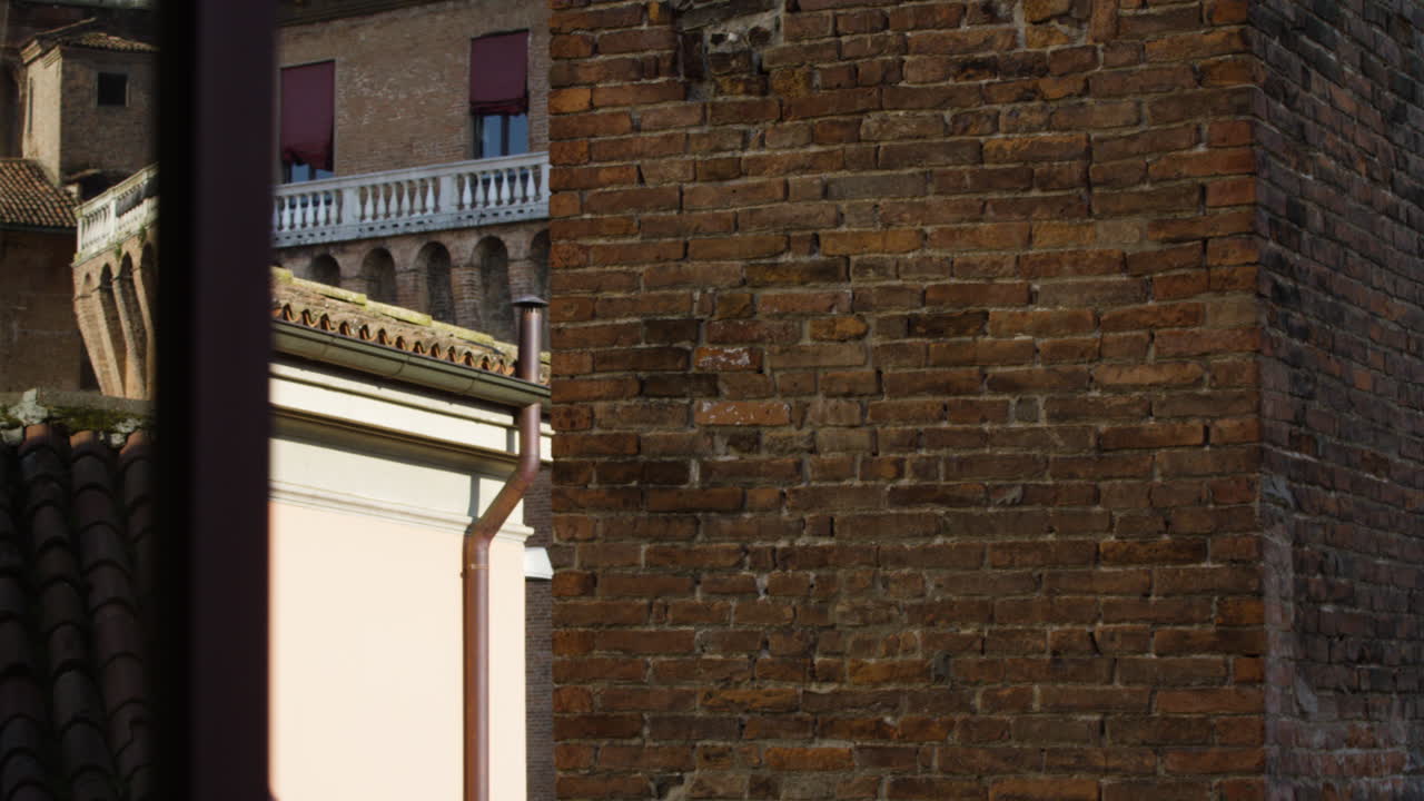 Este Castle in Ferrara, Italy, UNESCO World Heritage Site, medium shot pan left