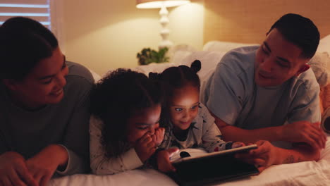 Funny,-tablet-and-family-in-bedroom-at-night