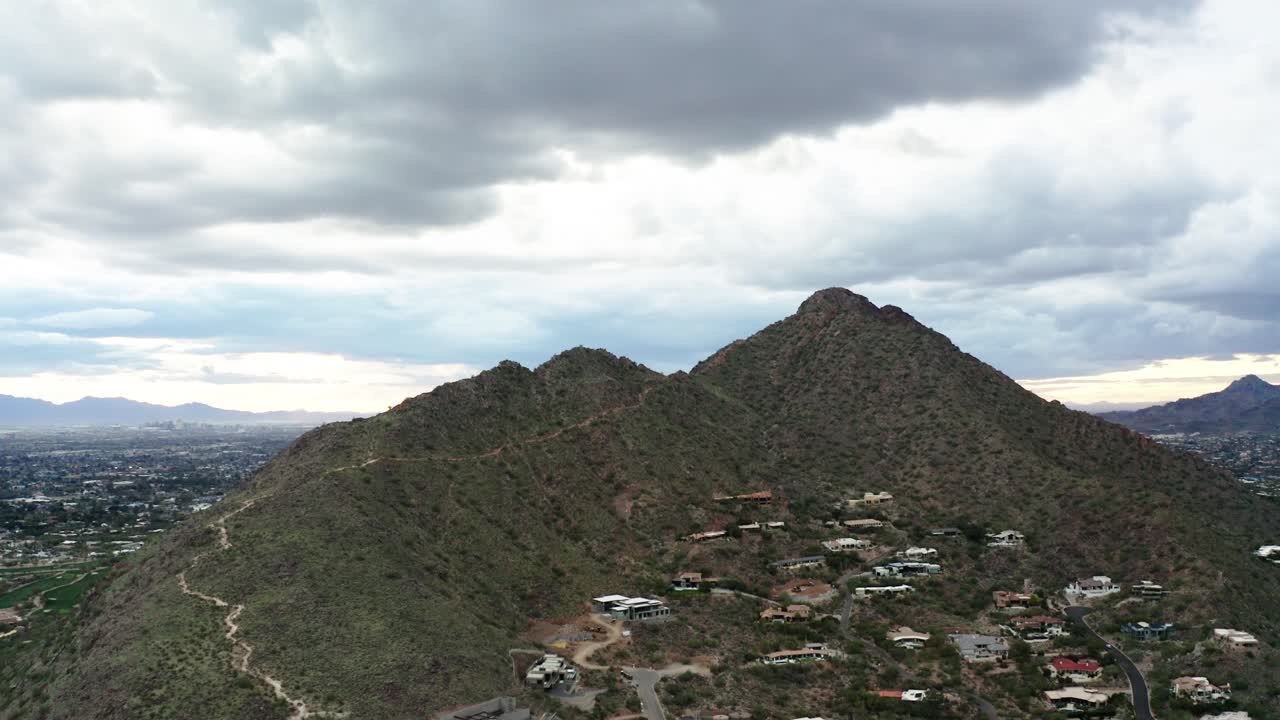Tilting down to reveal Camelback Mountain and surrounding homes in Arizona