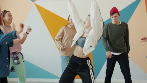 teenagers dancing in a dance studio