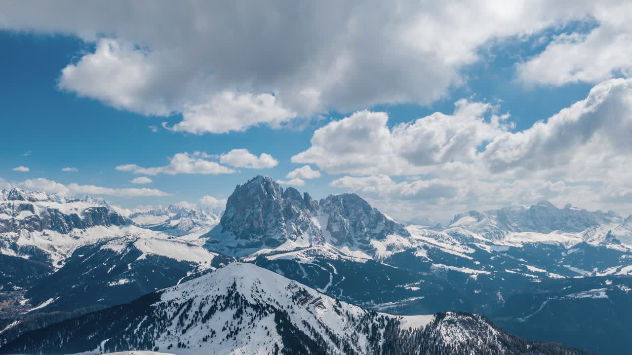 Dolomites, Sasso Piatto peak soaring into ethereal clouds, hyperlapse