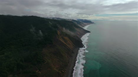 usal beach sinkyone wilderness lost coast trail northern california aerial drone rugged untouched coastline mist rain morning remote untouched waves crashing bluffs mountainside awd 4wd track backward